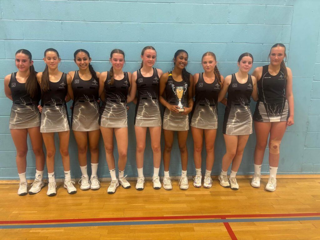 KWP GMJCCL winner team holding a trophy.